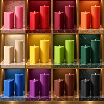Geometric Pillar Candle Set with vibrant colors displayed in a modern shelf arrangement.