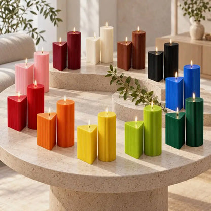 Colorful Geometric Pillar Candle Set showcased on a table with different shapes and heights in vibrant tones.