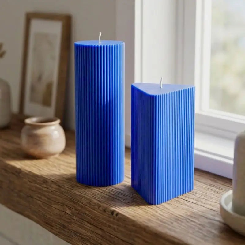 Geometric Pillar Candle set in blue, featuring ribbed triangle and column for stylish home decor.