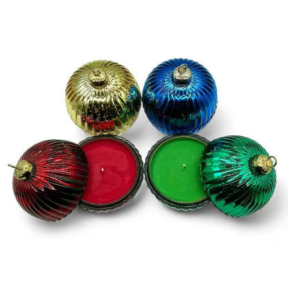 Festive Glass Bauble scented candles set in red, green, and gold glass jars with ribbed texture and decorative tops.