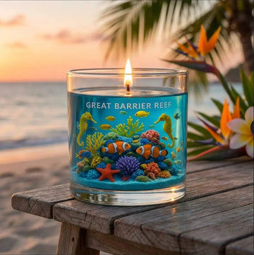 Tropical scented Candle with ocean-themed design on a beach setting