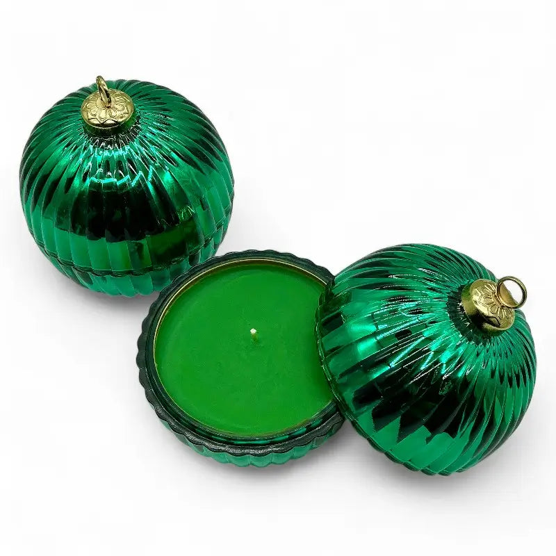 Glass Bauble Christmas Scented Candle in green glass jar with gold top, perfect for holiday decor and fragrance enhancement.