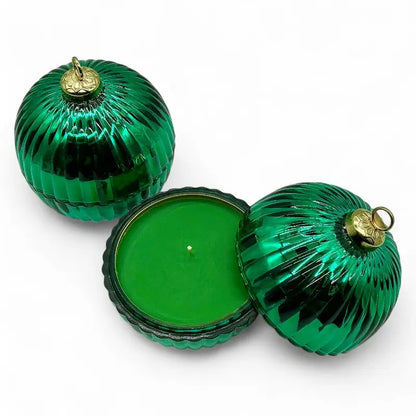 Glass Bauble Christmas Scented Candle in green glass jar with gold top, perfect for holiday decor and fragrance enhancement.