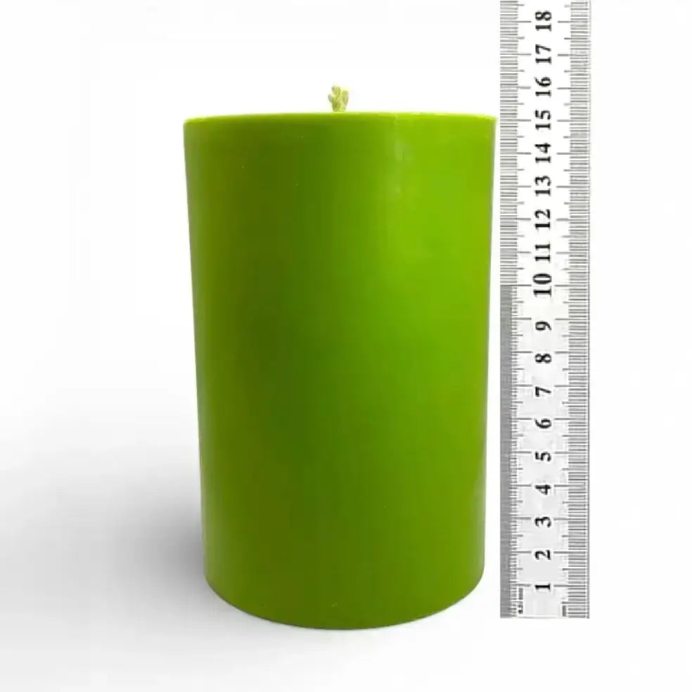 Extra Large Pillar Candle in vibrant green color, showcasing its height beside a ruler for size reference.