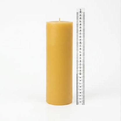 Giant Pillar Candle shown with a ruler for scale, measuring 27cm tall and 9cm in diameter.