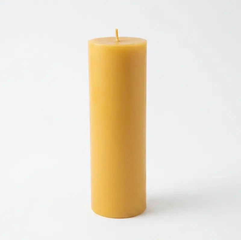 Big Candle in vibrant yellow color, oversized pillar design, perfect for bold décor and long-lasting fragrance.