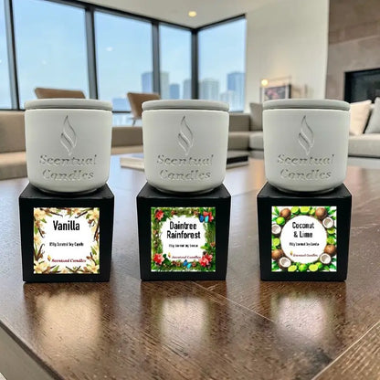 Housewarming Candle Gift Pack with 3 scented candles: Vanilla, Daintree Rainforest, Coconut & Lime displayed on a table.