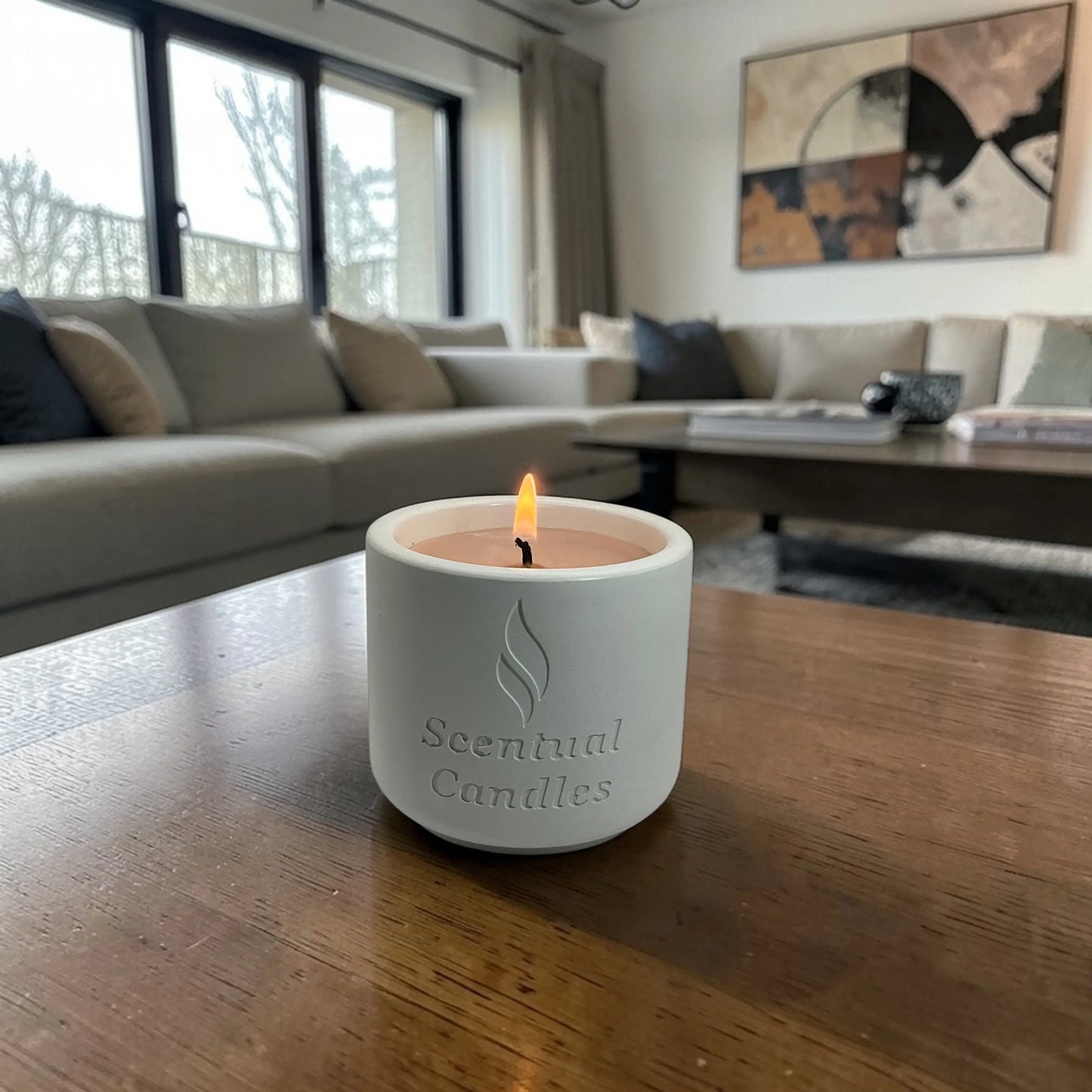 Housewarming Candle Gift creating a cozy ambiance in a stylish living room