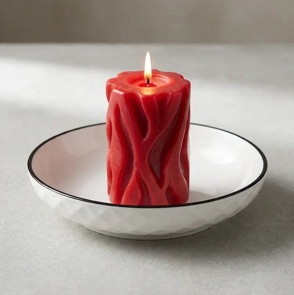 Large Ceramic Candle Plate with red pillar candle, featuring a diamond hexagon pattern and black rim.