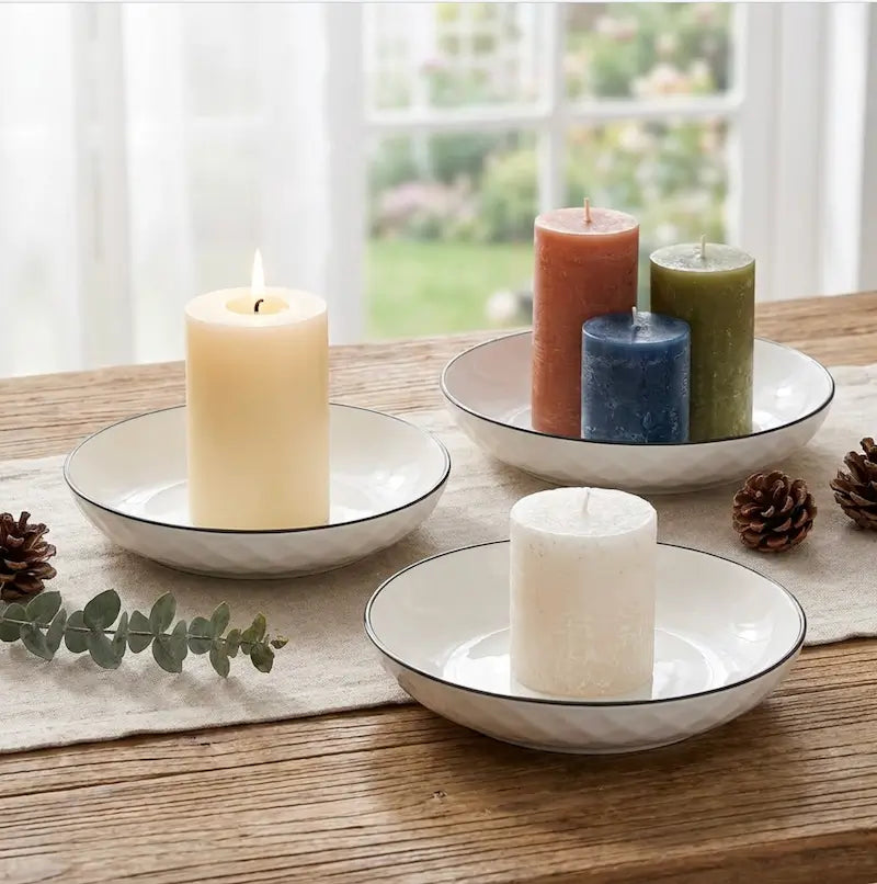Large Ceramic Candle Plate displaying various pillar candles on a wooden table with pine cones and greenery.