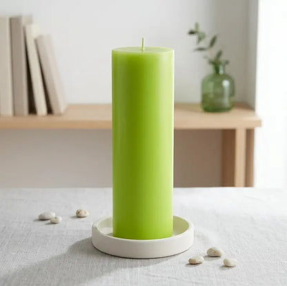 Big Candle in vibrant green color showcased on a white plate, perfect for bold home décor.