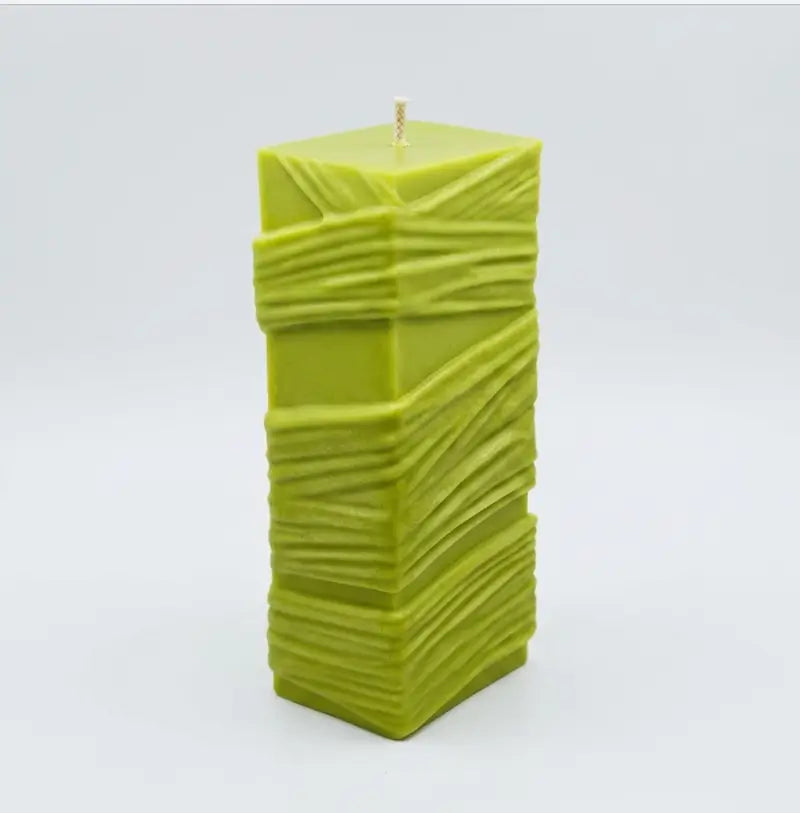 Custom Candle – Large Sculptural Design in vibrant green color with a textured surface.