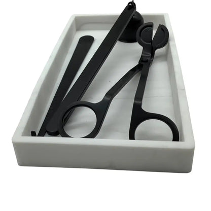 Set of black scissors and shears in a white box on a white background