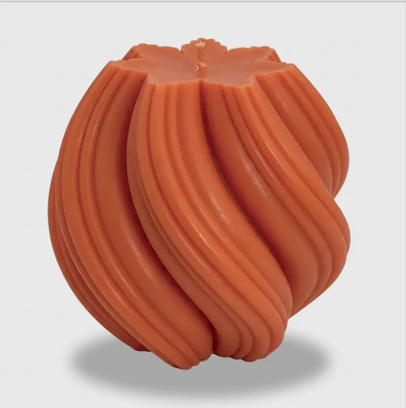 Extra large Ball Candle in vibrant orange, featuring a sculptural, swirled design, perfect for home decor.