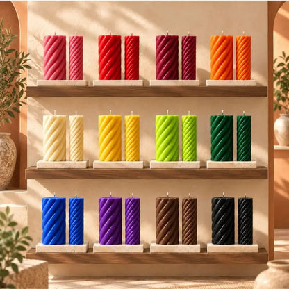 Pillar Candle Set displaying vibrant spiral columns in various colors on a wooden shelf.