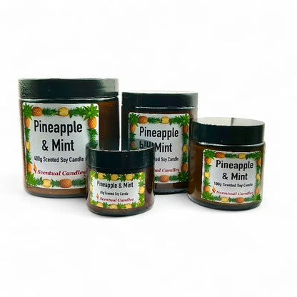 Four Pineapple and Mint scented candles of different sizes on a white background