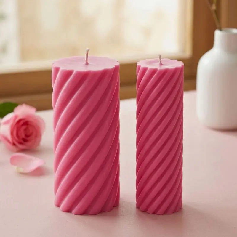Pillar Candle Set featuring two spiral columns in pink, one tall and broad, the other slim, perfect for home decor.