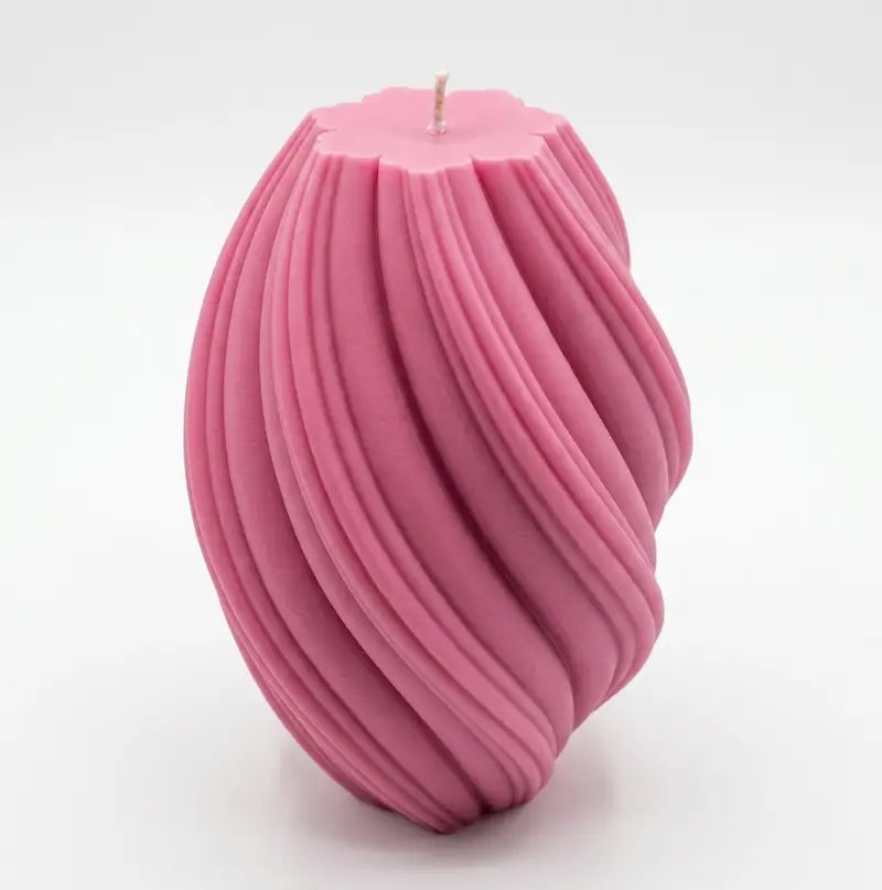 Large Pillar Candle in a swirly shape, pink color, showcasing unique sculptural design and handcrafted quality.