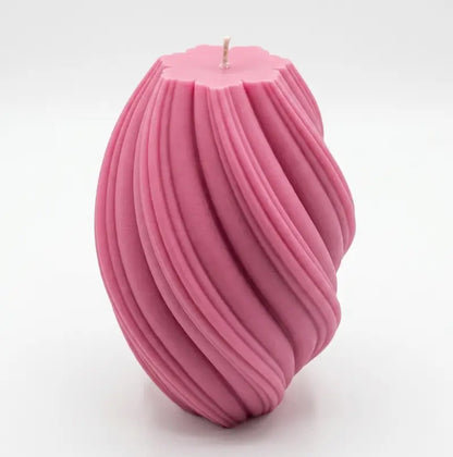 Large Pillar Candle in a swirly shape, pink color, showcasing unique sculptural design and handcrafted quality.