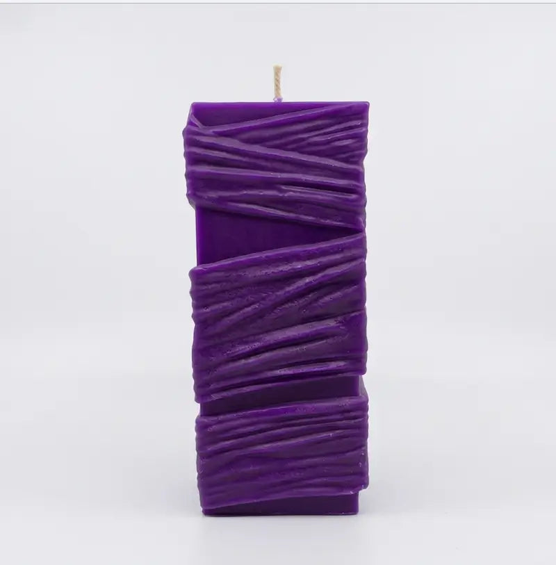 Custom Candle - Large Sculptural Design in purple, featuring a unique twisting texture and hand-poured craftsmanship.