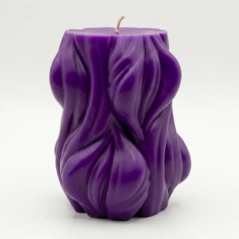 Decorative Candle in vibrant purple color with unique textured design, perfect for adding style to any decor.