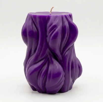 Decorative Candle in vibrant purple color with unique textured design, perfect for adding style to any decor.