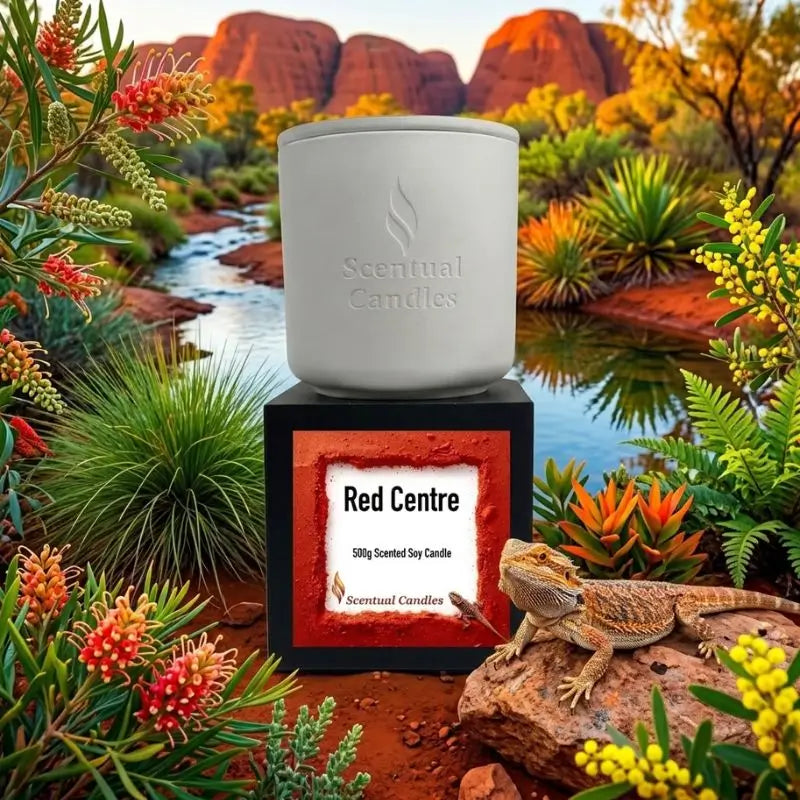 Red Centre Candle displayed in a desert landscape with a lizard, showcasing its warm Australian fragrance.