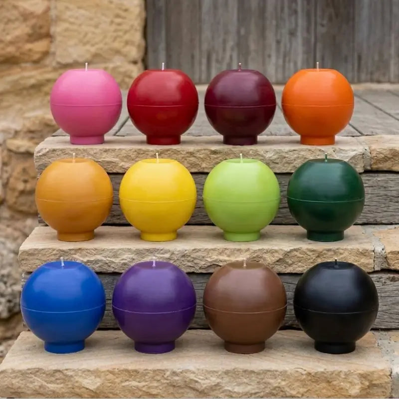 Round Candle assortment in various customizable colors on a rustic stone surface.