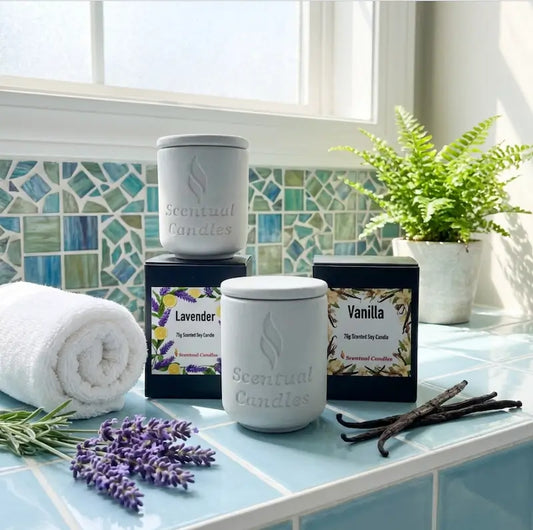 Scented Candle Duo featuring Lavender and Vanilla candles in a bright bathroom setting with greenery.