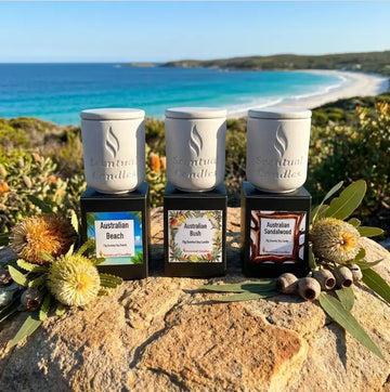 Scented Candle Trio featuring Australian Beach, Australian Bush, and Australian Sandalwood set against a scenic coastal backdrop.