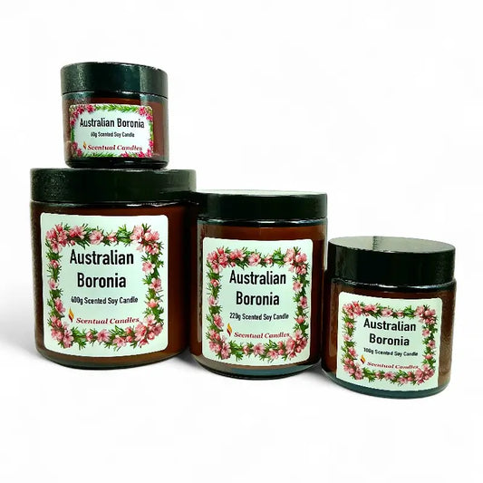 Four jars of Australian Boronia scented soy candle with floral labels on a white background