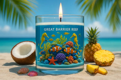 Great Barrier Reef themed candle from Scents of Australia Candle Set on a sandy beach with tropical fruits.