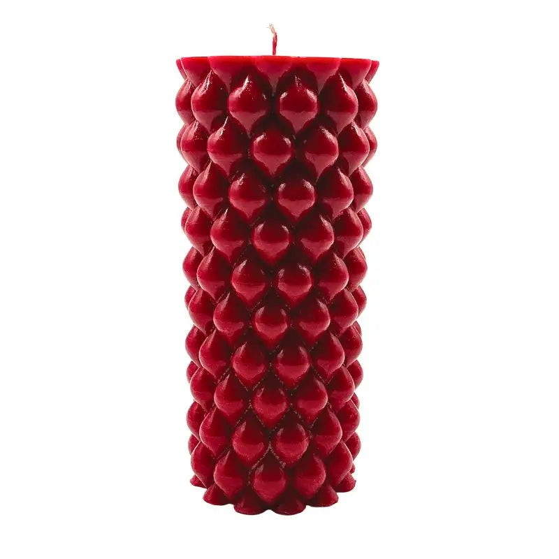 Vanilla and Cinnamon scented soy pillar candle with intricate texture, perfect for a cozy ambiance