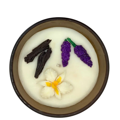 Decorative scented candles top with patchouli and vanilla elements on a white background