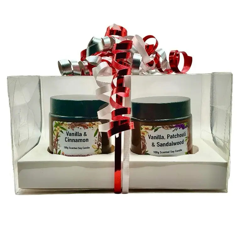 Vanilla and Spice Candle Gift Set with two soy candles in glass jars, beautifully packaged in a gift box with ribbon, perfect for gifting.