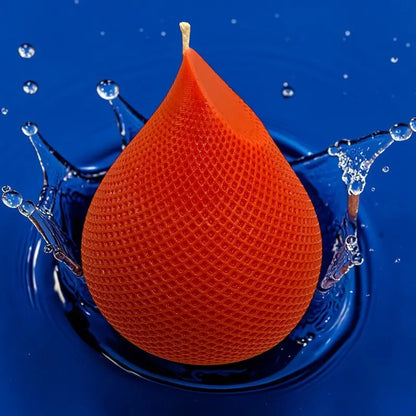 Water Drop Candle with geometric lattice pattern on a blue background, featuring a teardrop silhouette