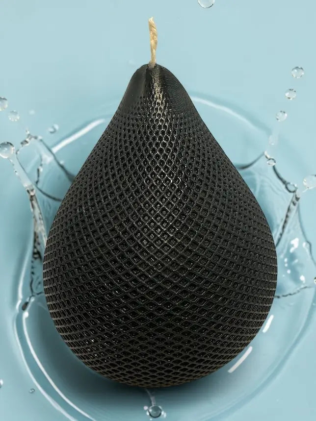Water Drop Candle with geometric lattice texture on blue background