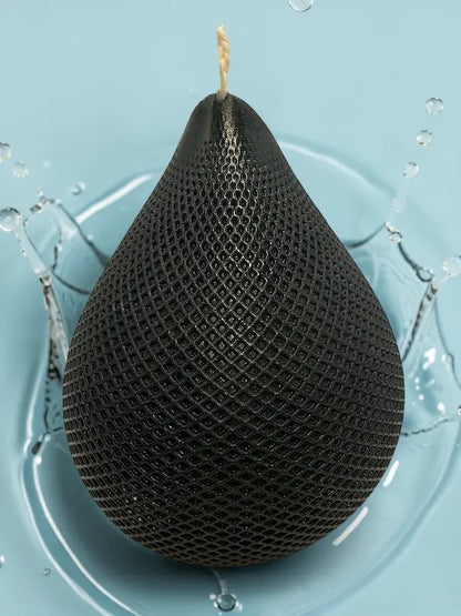 Water Drop Candle with geometric lattice texture on blue background