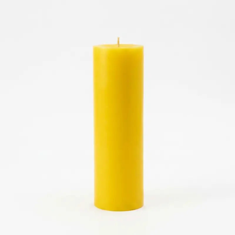 Giant Pillar Candle in vibrant yellow, 27cm tall and 9cm diameter, designed for extended use.