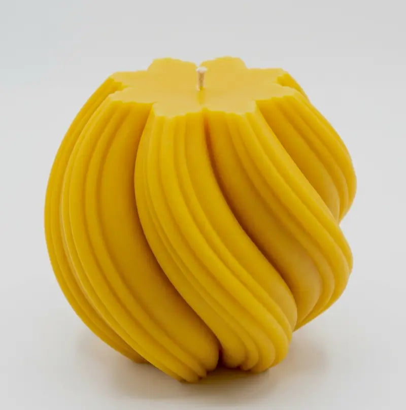 Extra large Ball Candle in bright yellow with a sculptural design, perfect for home decor and fragrance.