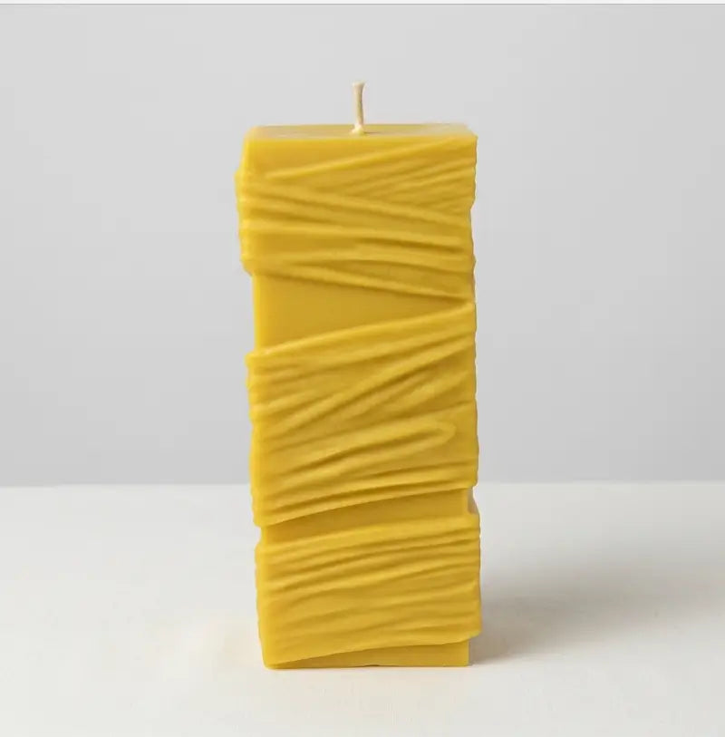 Custom Candle - Large Sculptural Design in warm yellow color with a textured surface, hand-poured to order.