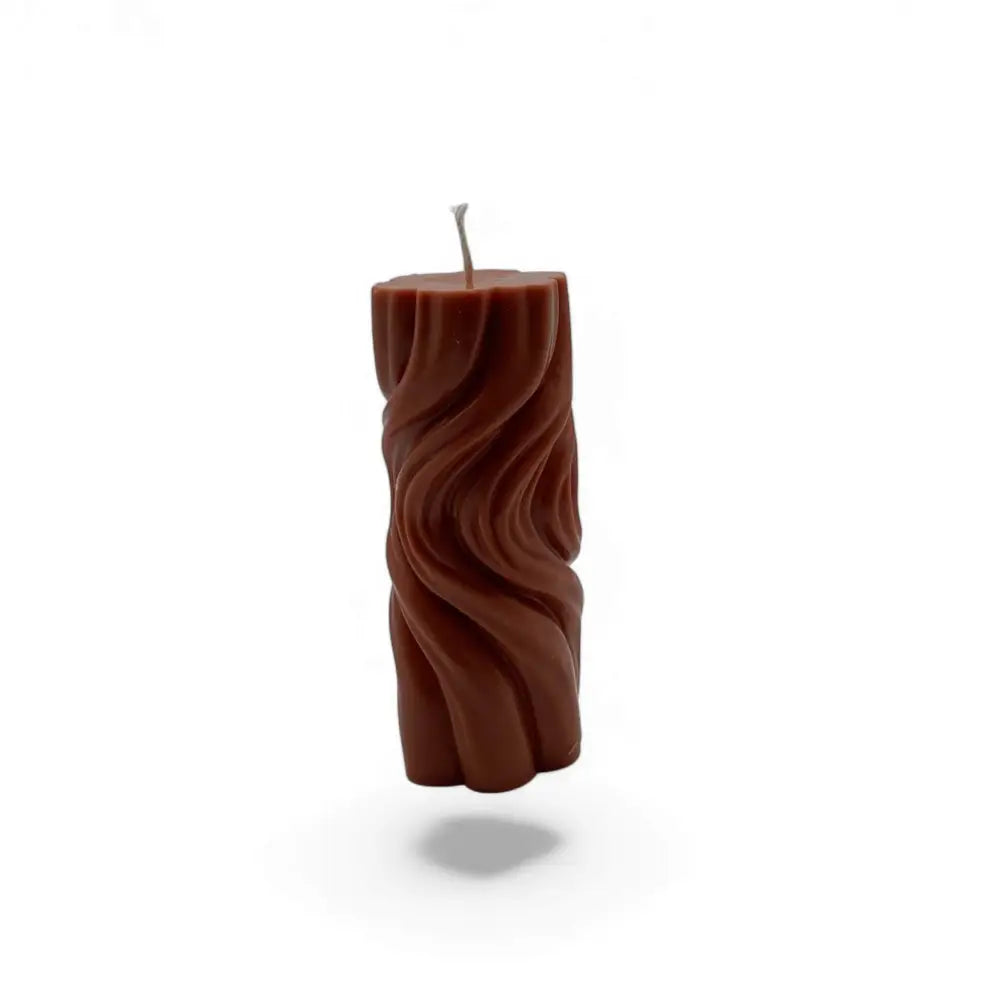 Caramelised Fig scented wavy soy pillar candle with artistic texture.