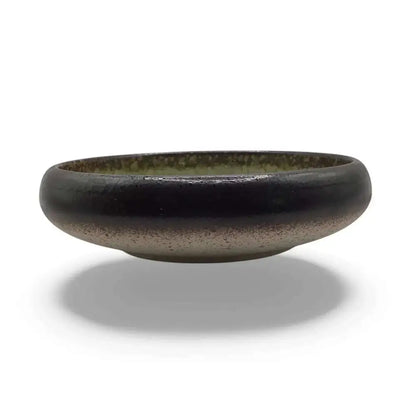 Ceramic candle holder plate, 14cm, in black with green accent, elegant and heatproof design.