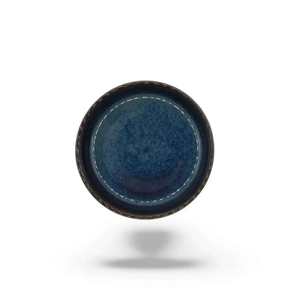 Ceramic candle holder plate 9cm in black with blue accent, top view.