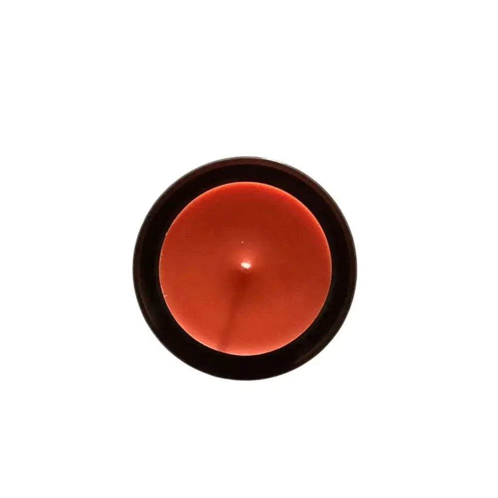 Ceramic candle holder plate with a sleek black and orange design, 9cm diameter.