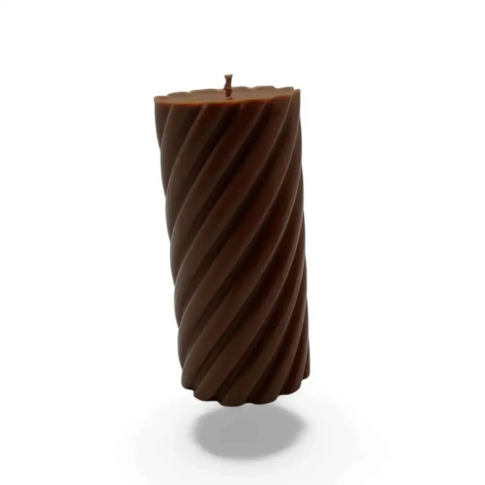 Chocolate candles scented soy pillar with elegant spiral design and decadent aroma.