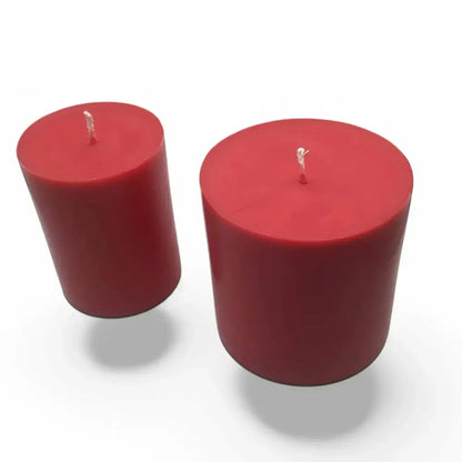 Fruit scented soy candle set of two, showcasing red pillar design against a white background.