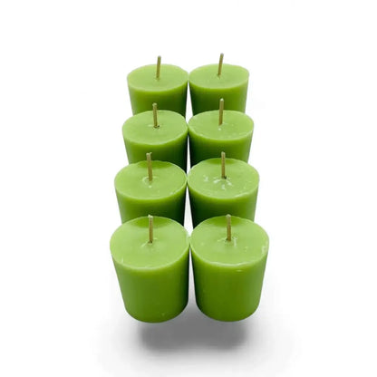 Set of eight green Gardenia Votive Candles made of scented soy wax in a coconut blend, ideal for creating an elegant ambiance.