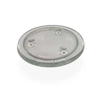 Round transparent glass candle holder plate with small feet for stability and heat protection.