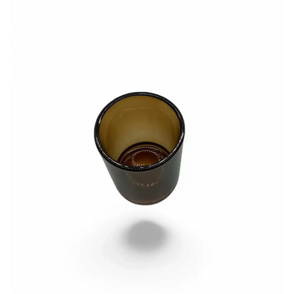 Amber glass votive candle holder with elegant design, shown in a warm, rich hue.